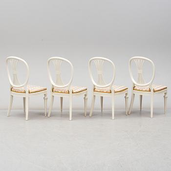 Four chairs with dinner table, late 20th Century.
