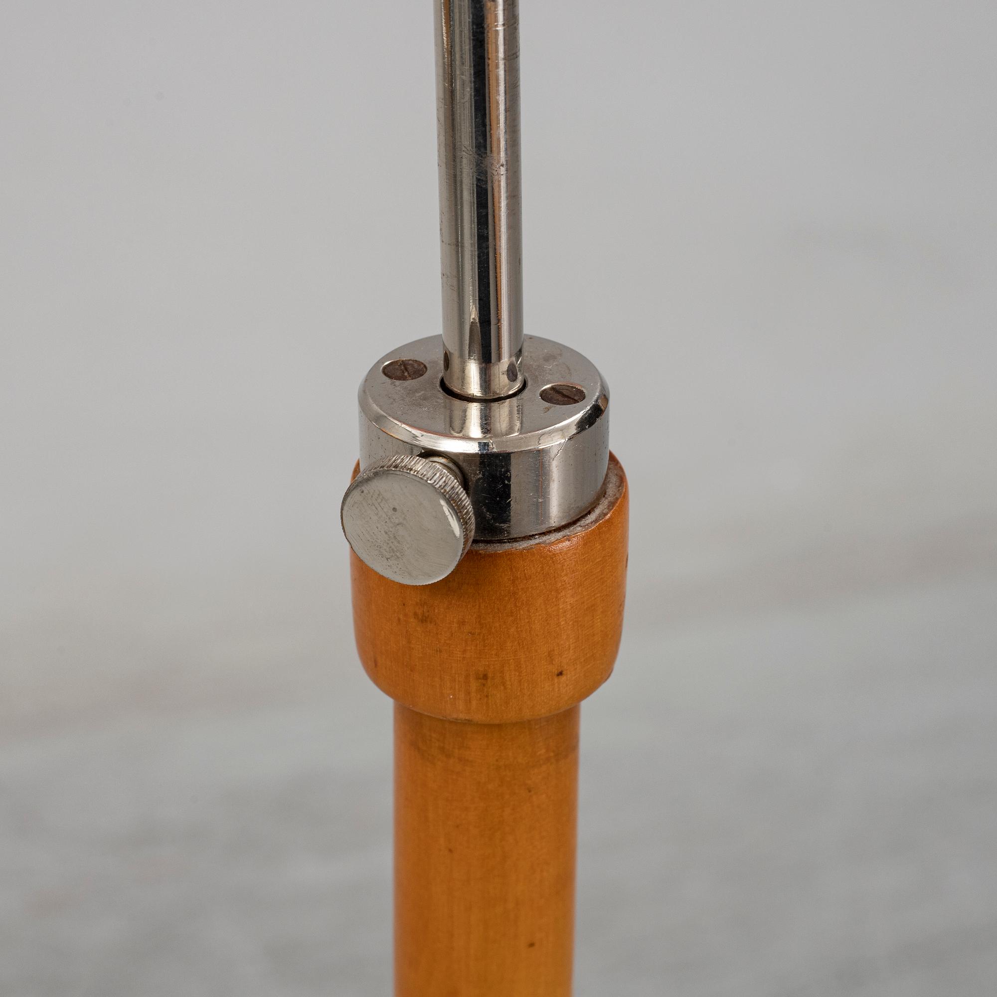 A 1940s birch wood floor lamp.