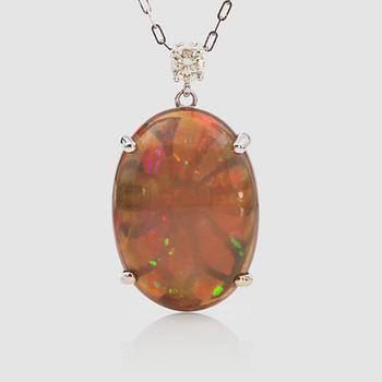 1331. A 8.75 ct honey-opal and brilliant-cut diamond pendant. Chain included.
