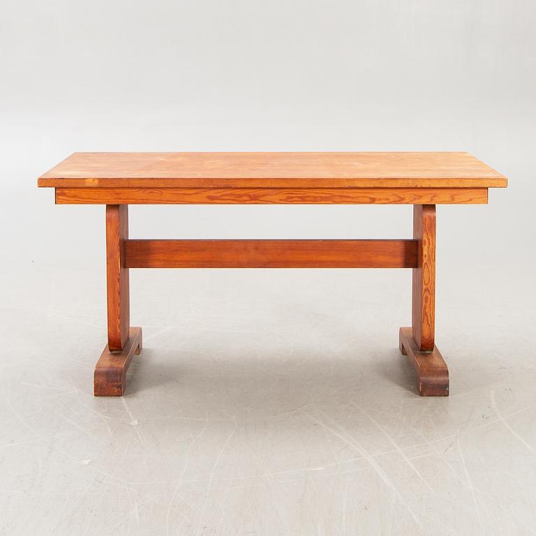 A 1940s pine dining table.