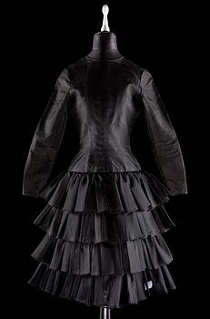 1508. A black silk cocktail dress.