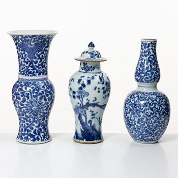 Two blue and white vases, Qing dynasty, 19th century and a blue and white vase with cover, 18th century.