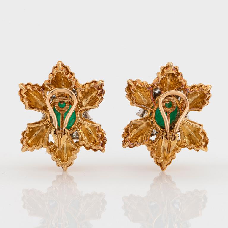 A pair of 18K gold earrings set with cabochon-cut emeralds and round brilliant-cut diamonds.