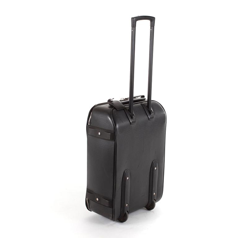 LOUIS VUITTON, a black leather suitcase, "Pegase".