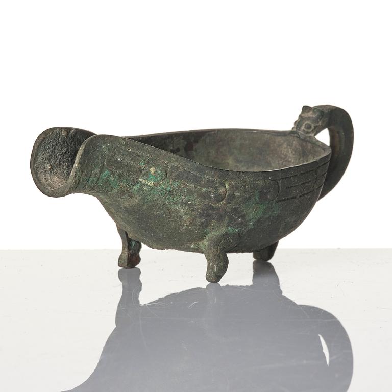 A Chinese brushpot, Qing dynasty, circa 1900. An archaistic bronze ewer and a silvered South East Asian bowl with stand.