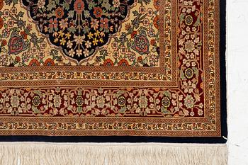 A Hereke silk rug, c. 130 x 71 cm.