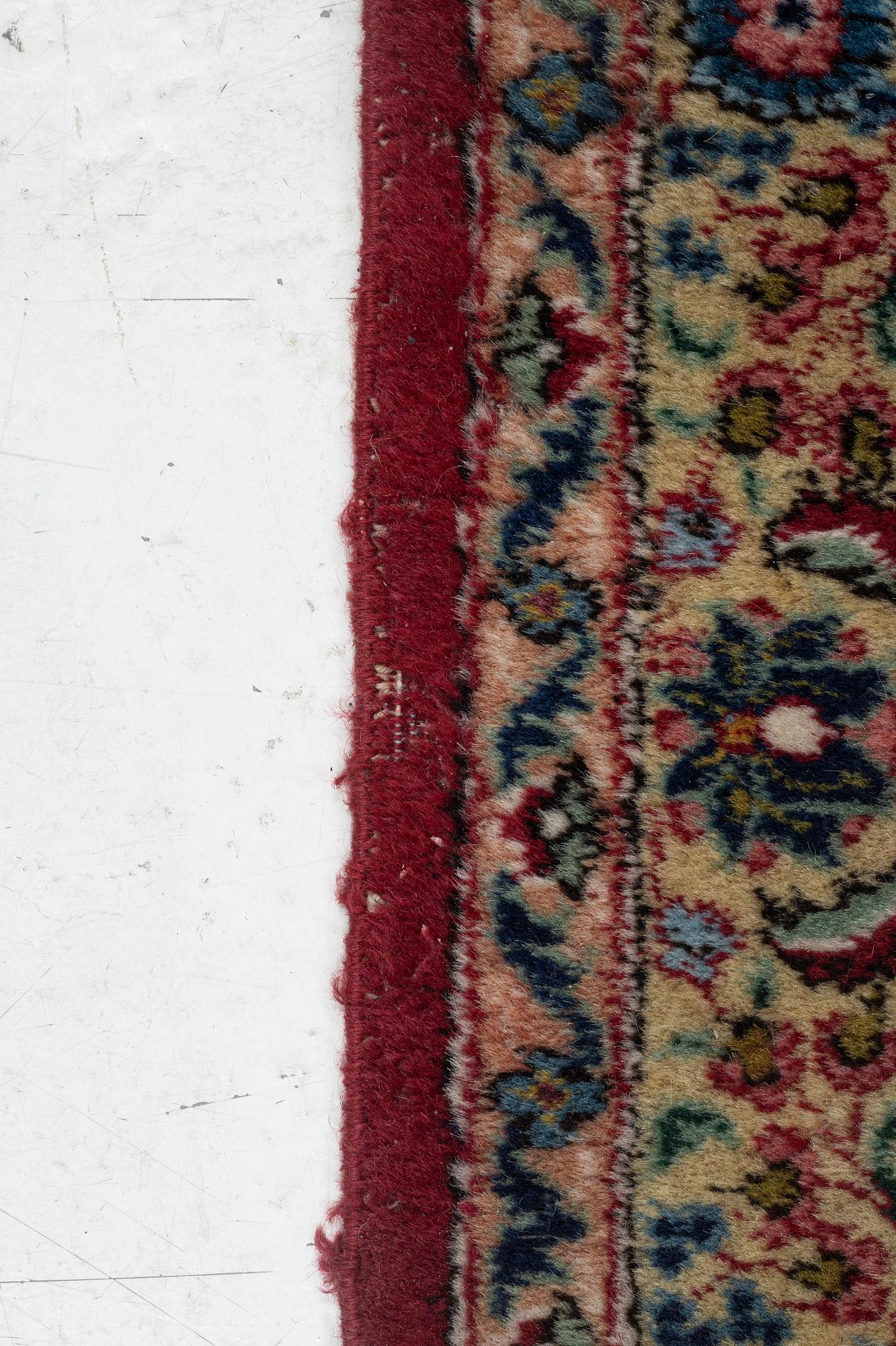 A semi-antique/old carpet, presumably Tabriz, x. 363 x 272 cm.