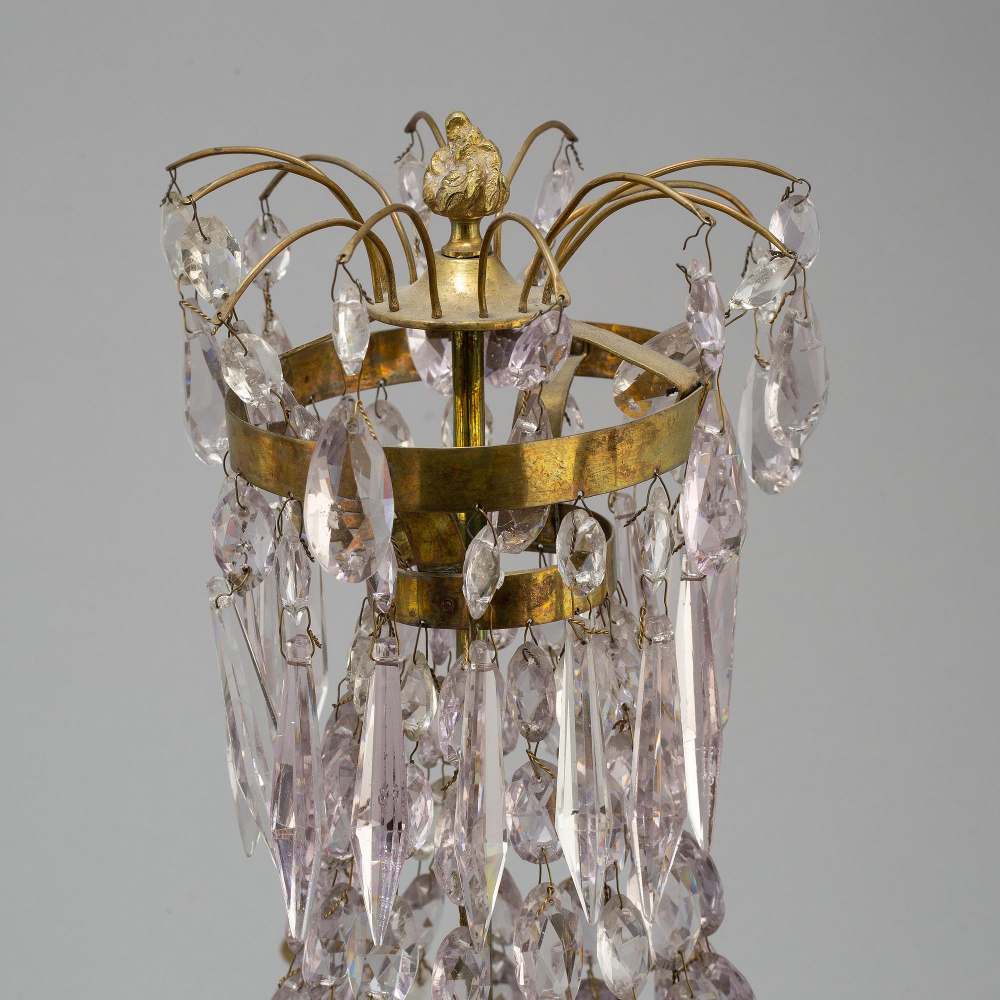 A pair of late Gustavian style three-light candelabra.