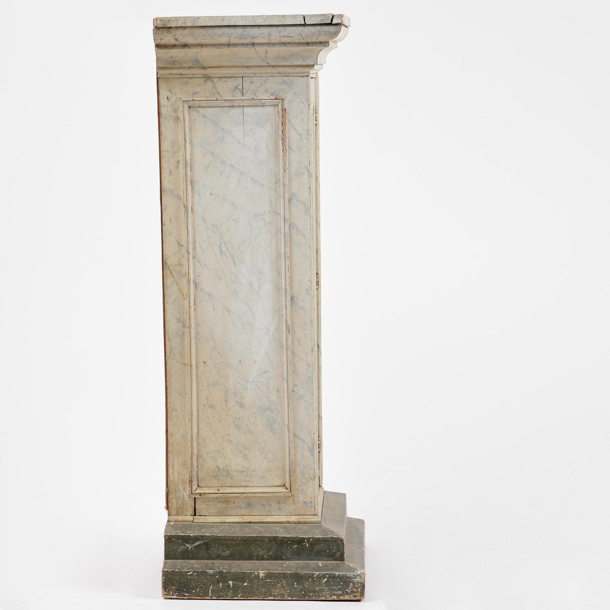 A Swedish column-shaped cabinet 19 th century.