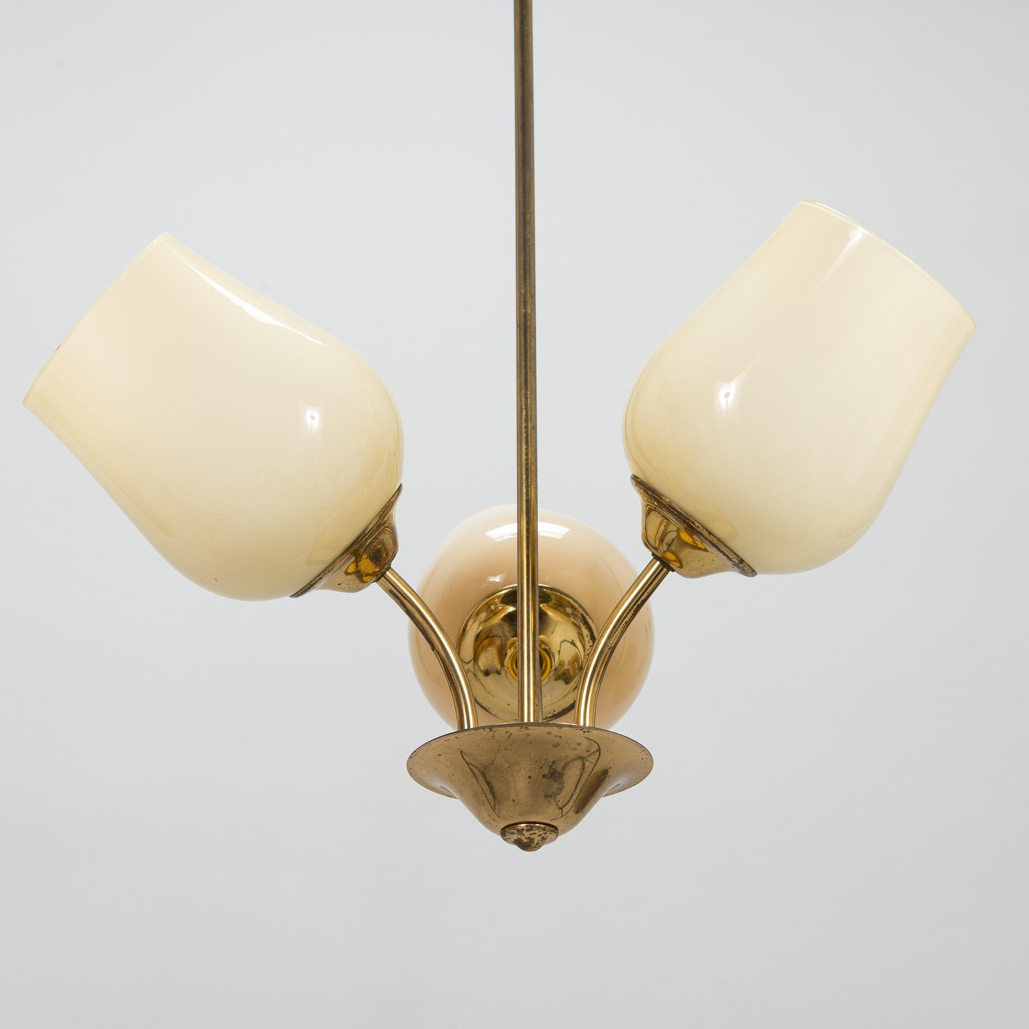 A mid 20th century brass pendant ceiling light, manufactured by Itsu, Finland.