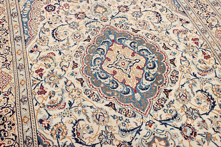 A Nain carpet, part silk, 9 laa, c. 300 x 195 cm.