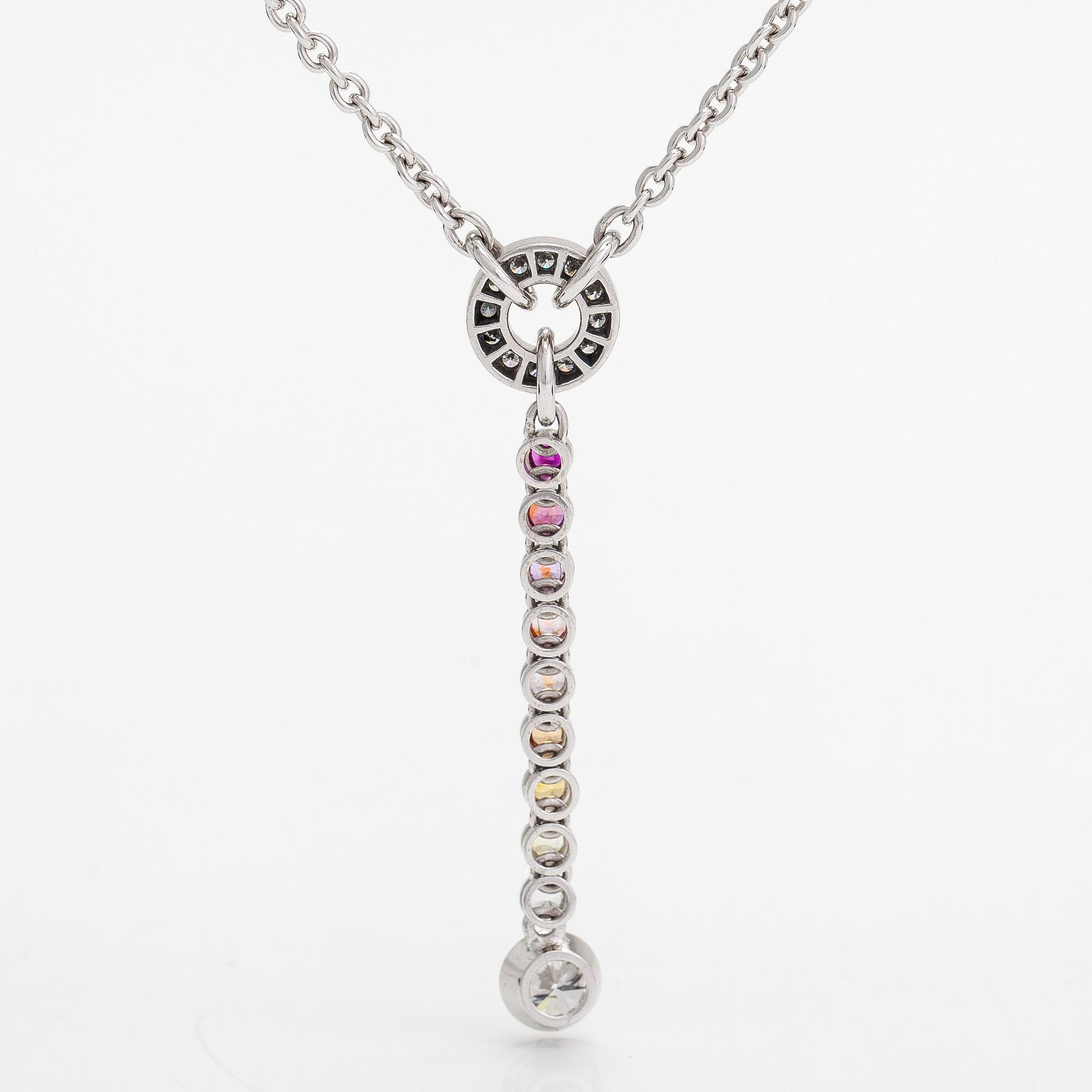 An 18K whitegold necklace with a diamond ca 1.01 ct, smaller diamonds tot. ca 0.15 ct, ruby and 
sapphires, Helsinki.