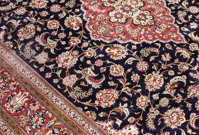 A Ghom silk carpet, approx. 340 x 239 cm.