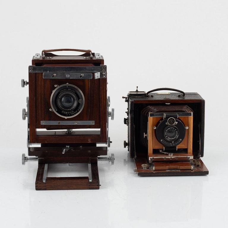 Two box cameras with accessories and a handheld stereo viewer.