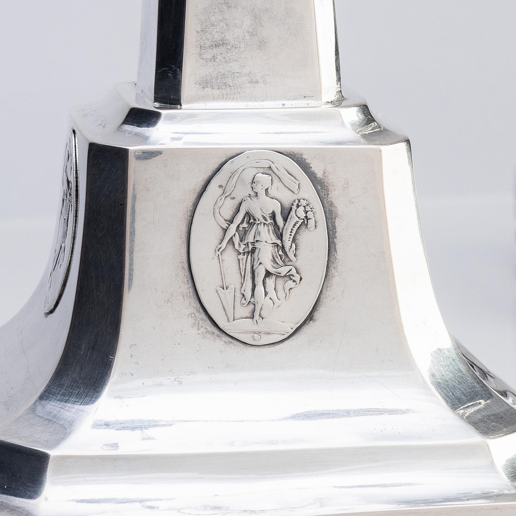 A pair of Swedish silver candelabras, marks of Pehr Zethelius, Stockholm 1797 and Daniel Hedberg, Eksjö 1829.
