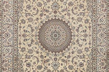 A Nain carpet, part silk, 6 laa, c. 295 x 205 cm.
