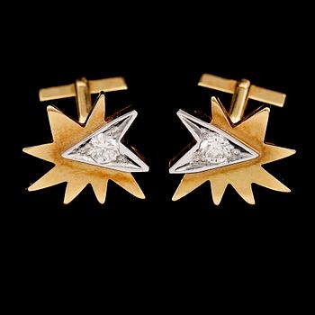 MANSCHETTKNAPPAR, 1 par, 18 k guld/vitguld, briljantslipade diamanter tot ca 0.90 ct. Total vikt 27 g.