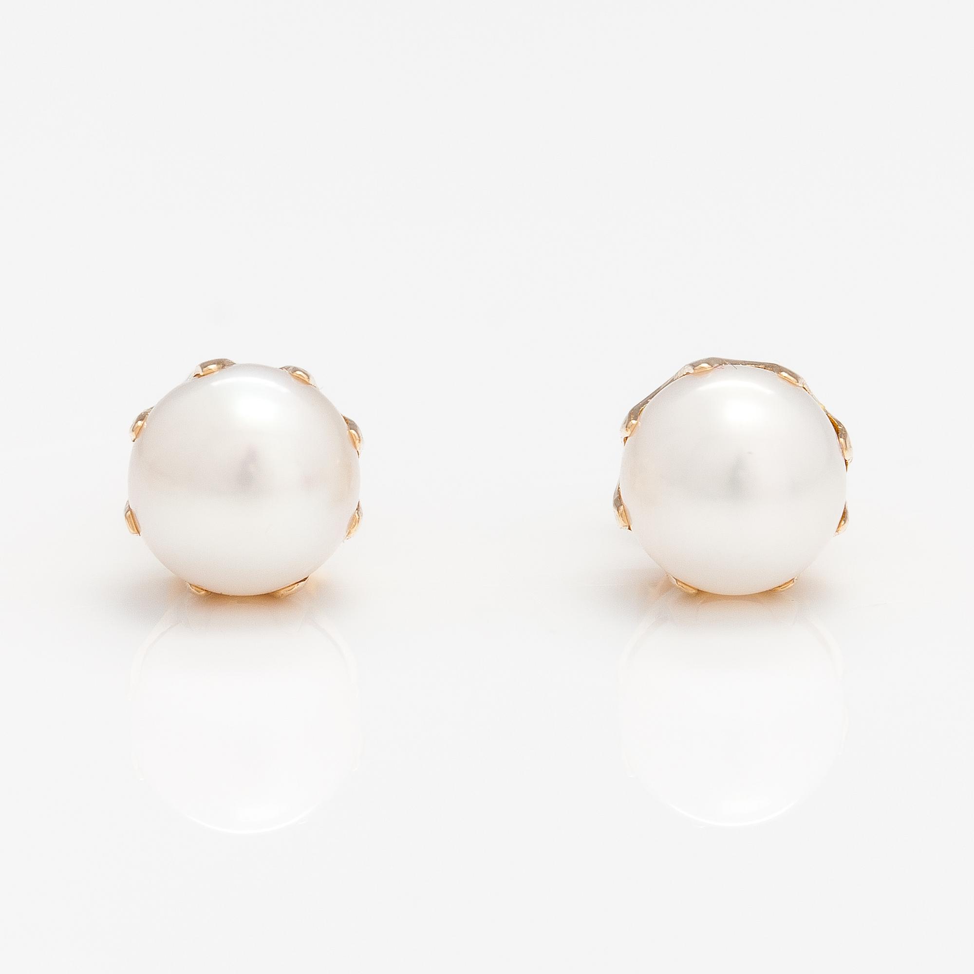 A pair of 14K gold earrings with cultured pearls.