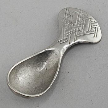 A "Kirun" salt bowl with spoon in pewter, made by Lars Pirak, second half of the 20th century.