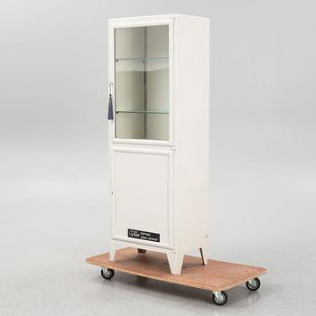 Medicine cabinet with display case, mid-20th century.
