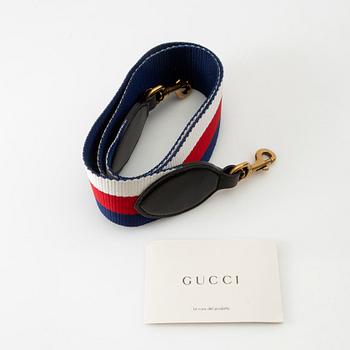 Gucci,.