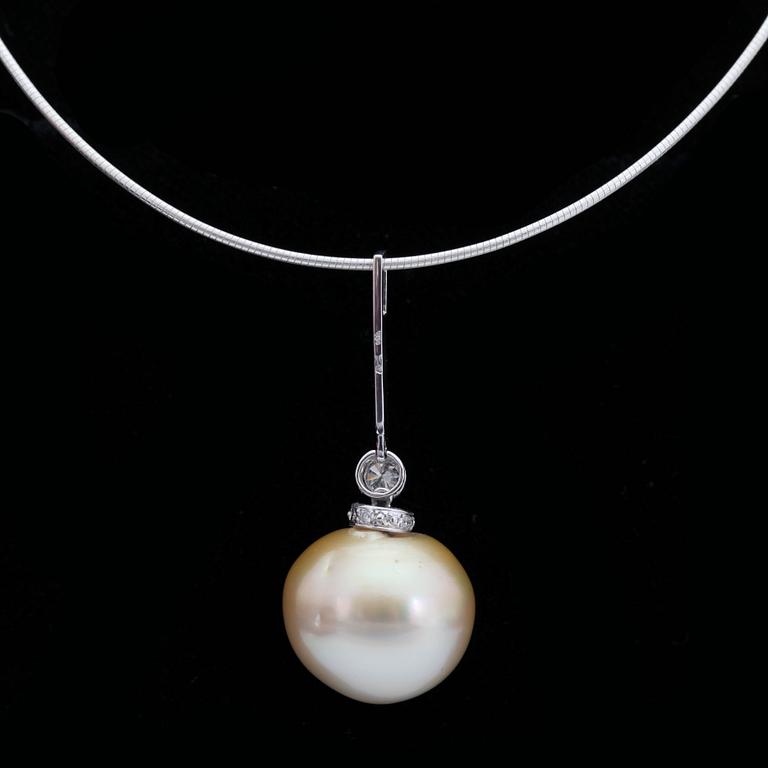 A South sea pearl pendant , 15x18 mm, set with a brilliant cut diamond, 0.20 ct.
