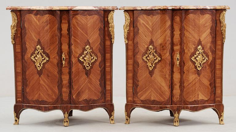 A pair of Louis XV 18th century corner cabinets by F. Reizell.