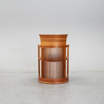 A model 606 'Barrel' chair by Frank Lloyd Wright for Cassina, designed 1937.