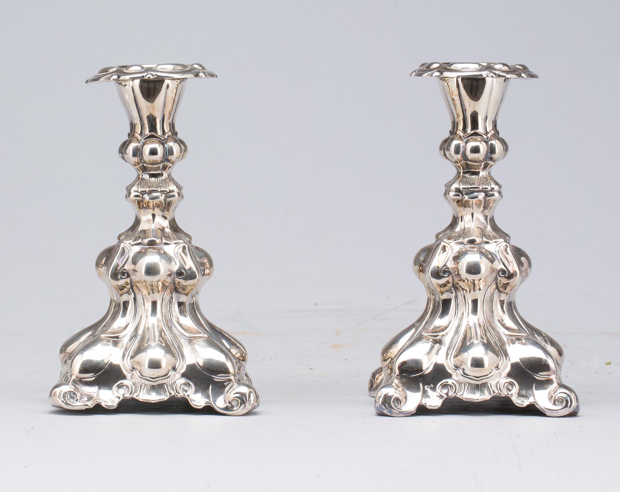 LJUSSTAKAR, silver. 1900-tal.