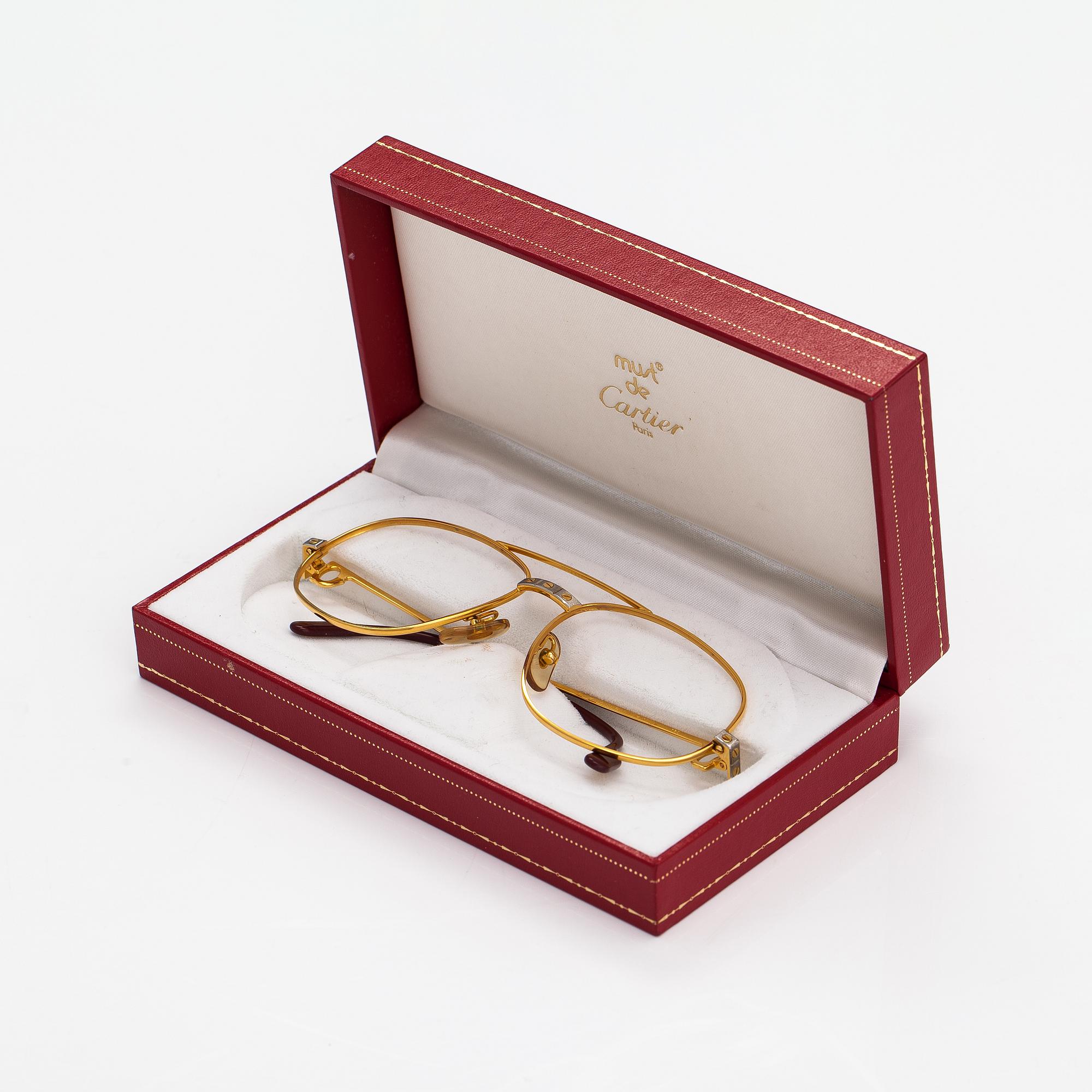must de Cartier, Santos, a pair of eyeglass frames. Marked Cartier, Paris, Made in France 135, 56, 16.