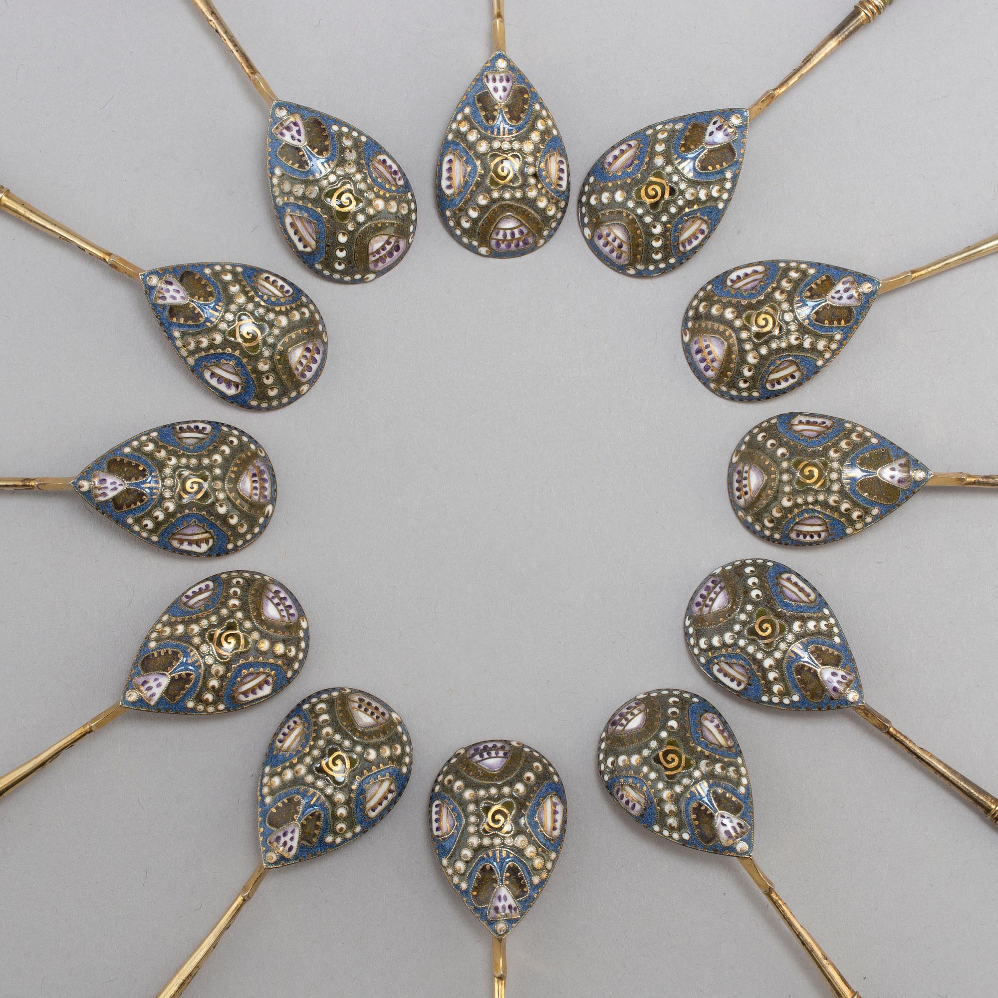 A set of twelve Fabergé silver-gilt and cloisonné enamel tea-spoons small, work master Fedor Rückert, Moscow 1908-1917.