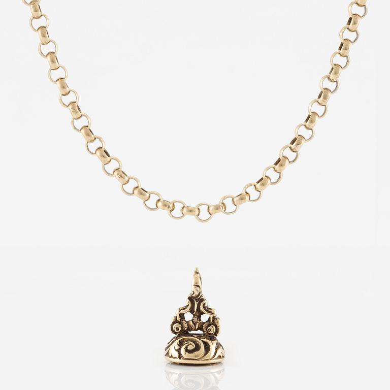 Sigill 14K guld och graverad gulaktig sten, möjligen citrin.