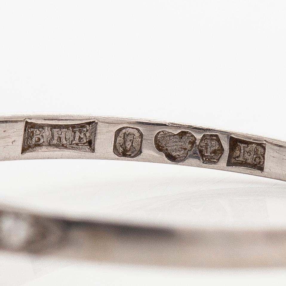 A platinum ring, with a brilliant- and single-cut diamonds, Stockholm 1935.