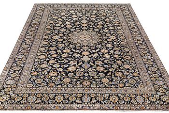 A Kashan carpet, signed, c. 410 x 270 cm.