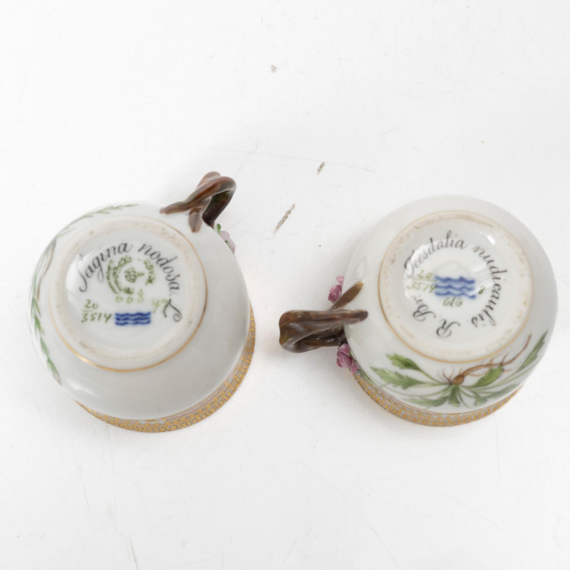 A pair of Royal Copenhagen 'Flora Danica' custard cups with covers and stands, Denmark, 20th century.