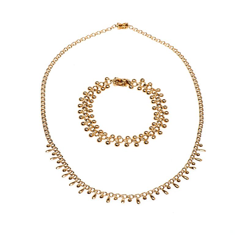 HALSKED och ARMKED, 14K guld. Finska kontrollsstämplar. Vikt totalt ca 11,6 g.