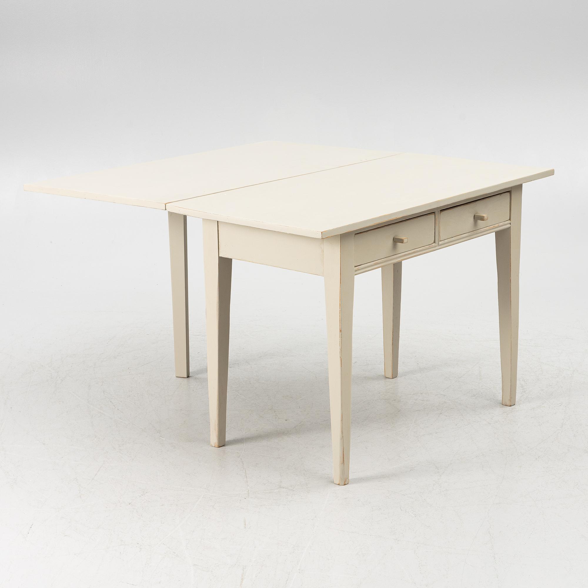 A drop-leaf table, late 19th century.