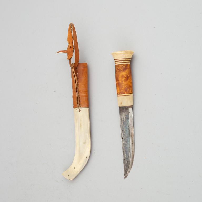 Esse Poggats, a reindeer horn Sami knife, signed.