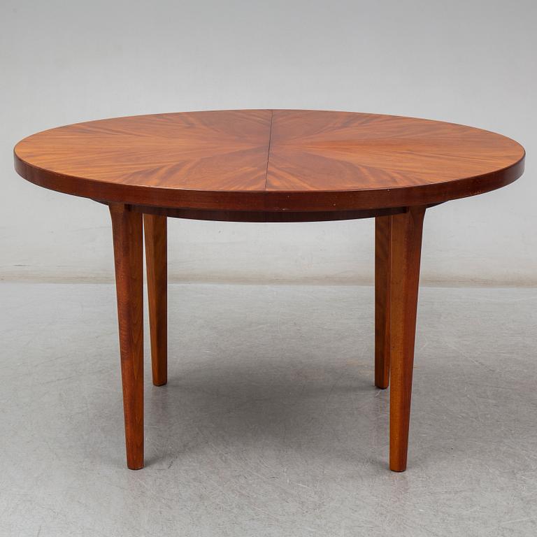 a mahogany dining table from the mid 20th century.