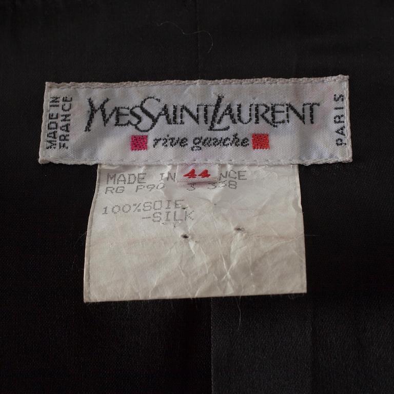 A darkgreen silk and black velvet jacket by Yves Saint Laurent.