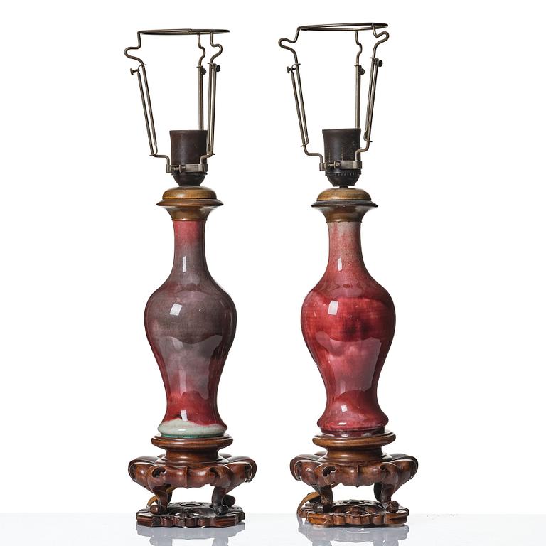 A pair of sang de boef glazed vases, Qing dynasty, 19th Century.