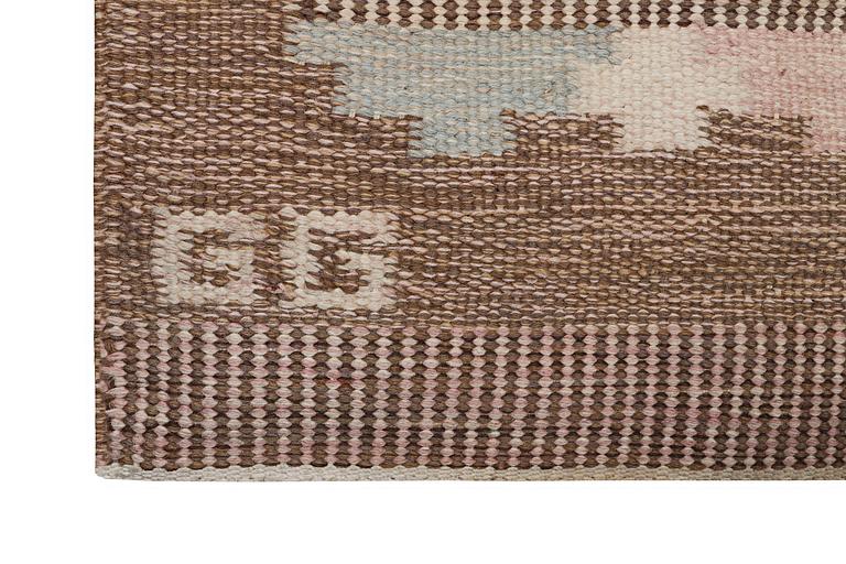 A flat weave carpet, signed GG, c. 190 x 133 cm.