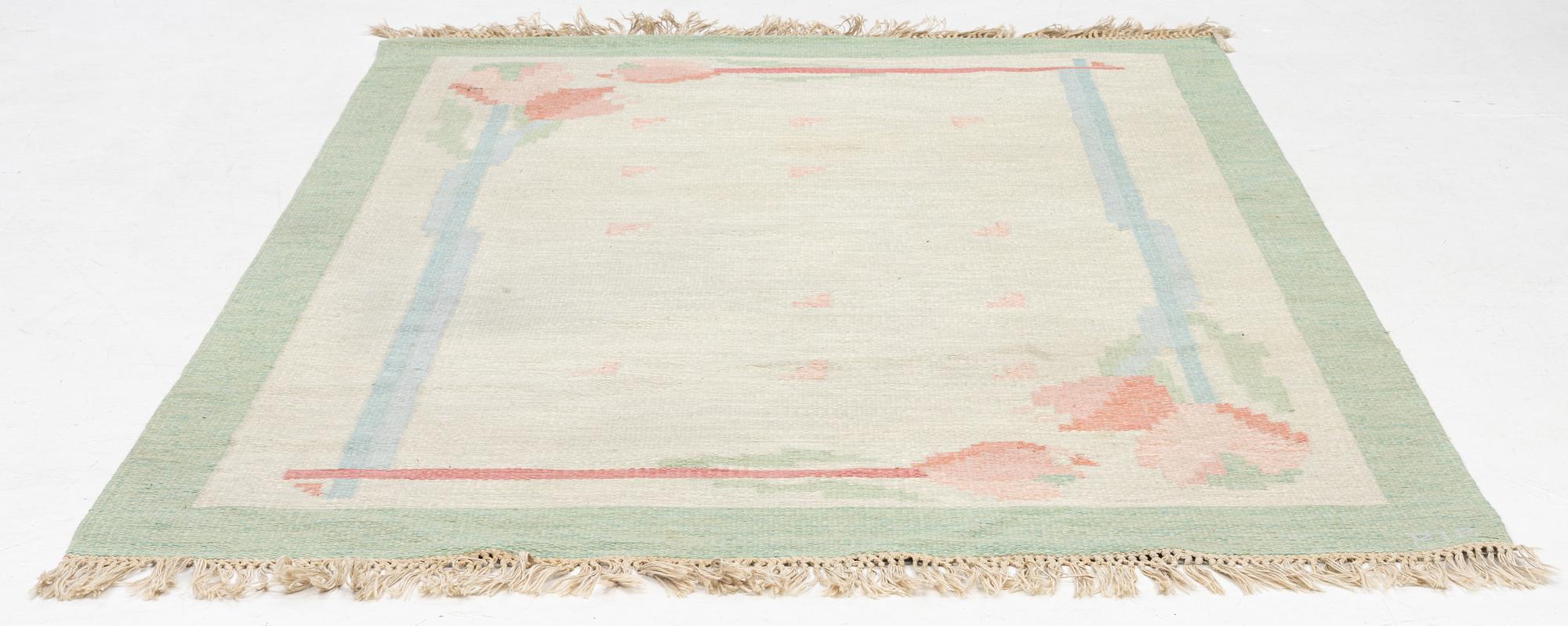 A flat weave carpet, signed PIA, c. 244 x 163 cm.