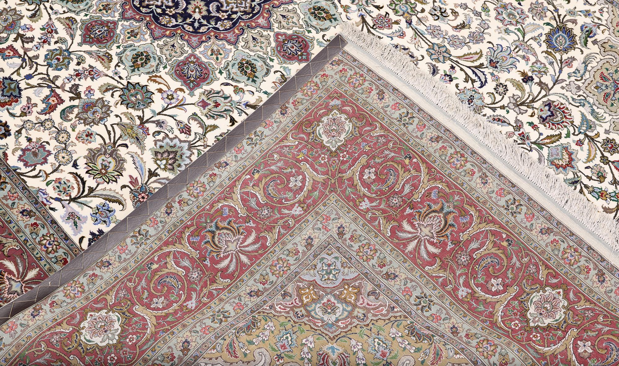 A part silk Tabriz carpet, 310 x 205 cm.
