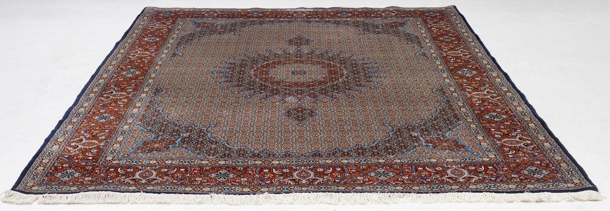 A Moud carpet, part silk, signed, c. 345 x 249 cm.