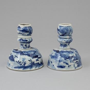 A pair of blue and white candlesticks, late Qingdynasty.