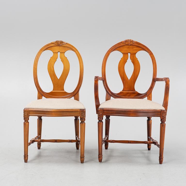 A Gustavian style dining table with two armchairs and four chairs, late 20th century.
