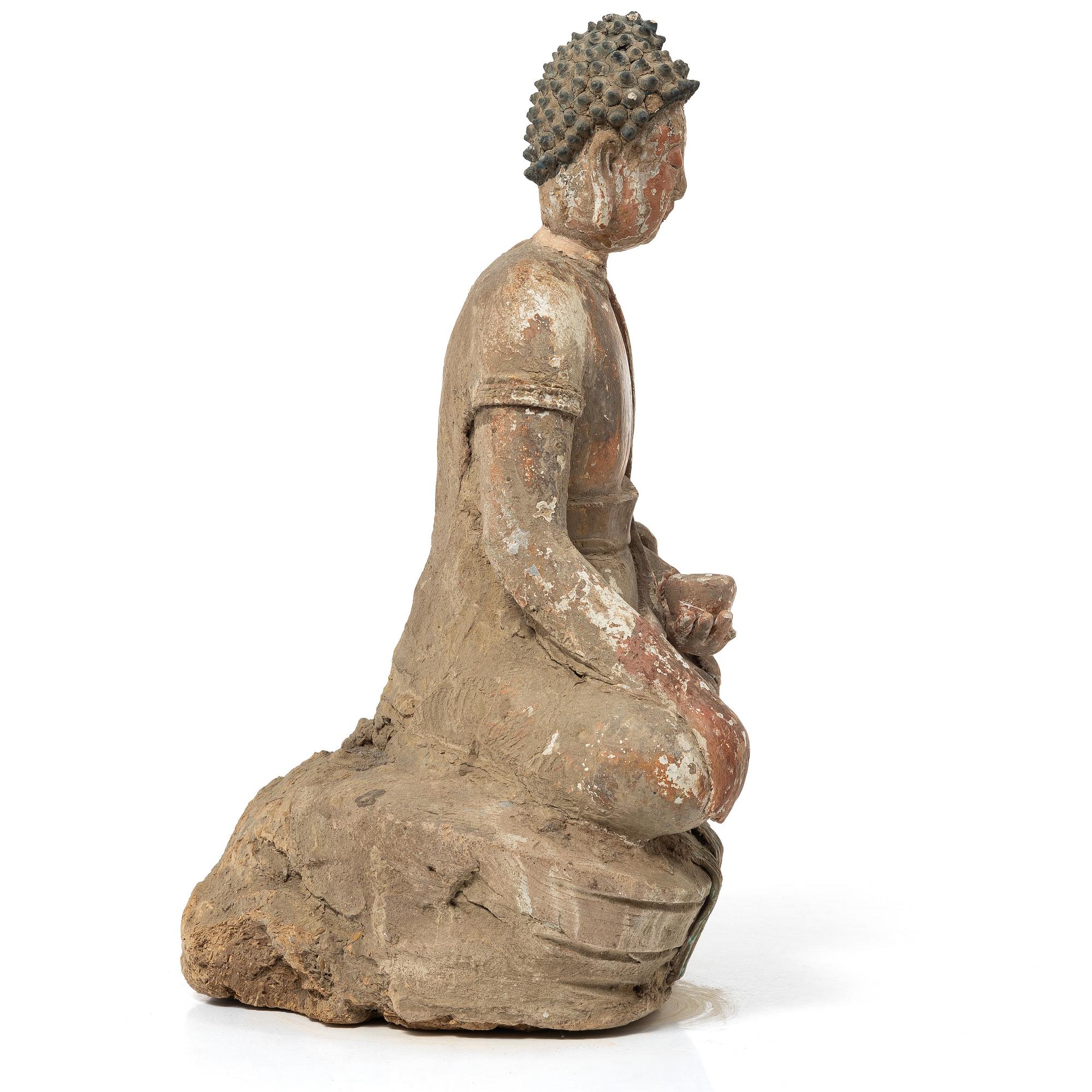 A Southeast Asian figure of a Buddha, 20th century.