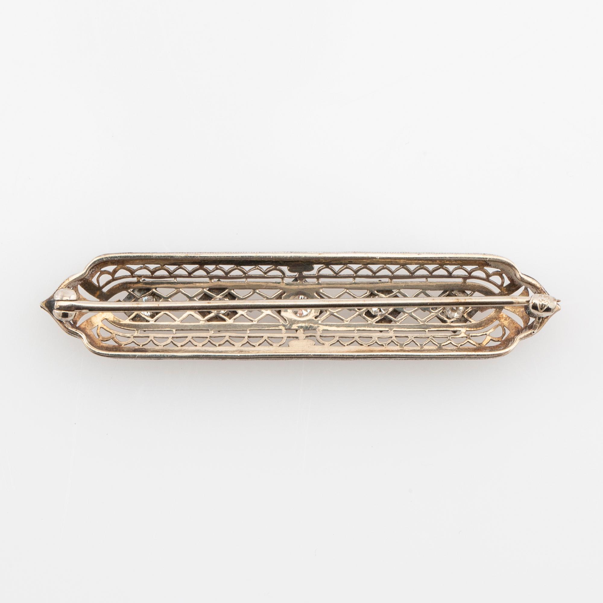 Brooch 14K white gold with round old-cut diamonds.