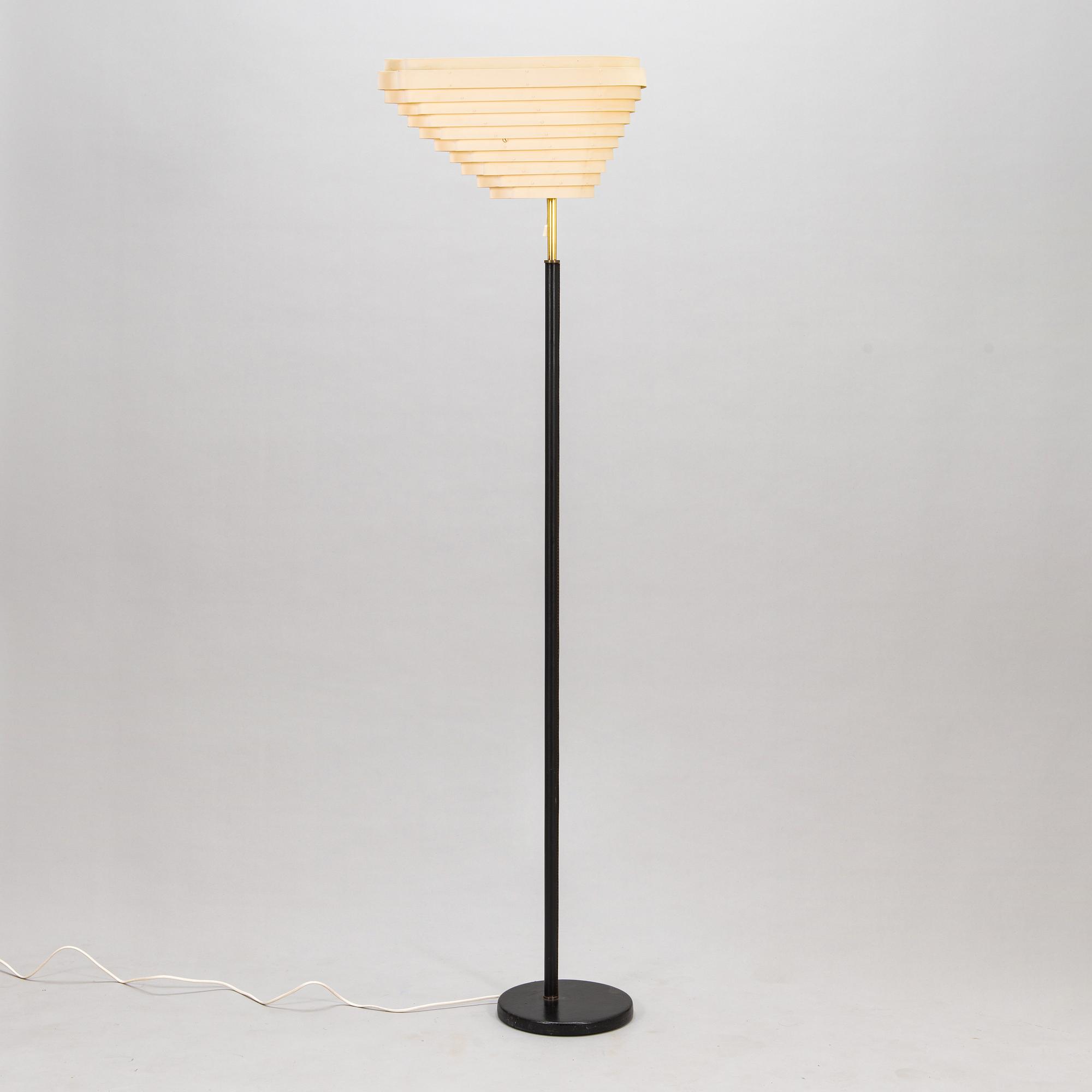 Alvar Aalto, an 'Angel's Wing' floor lamp. Manufactured by Valaistustyö.